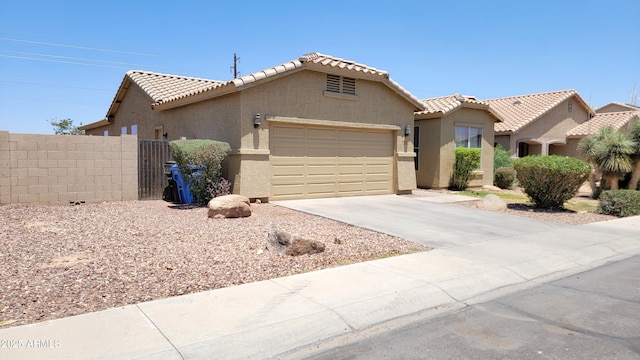 4432 W Pleasant Ln, Laveen, AZ 85339 - view of front of property with a garage, a tiled roof, driveway, and stucco siding