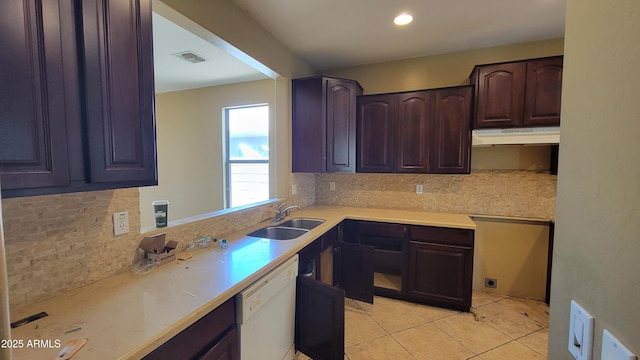 4432 W Pleasant Ln, Laveen, AZ 85339 - kitchen with a sink, under cabinet range hood, dishwasher, backsplash, and light tile patterned floors