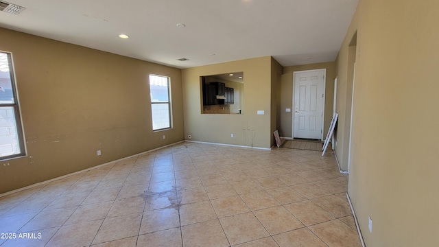 4432 W Pleasant Ln, Laveen, AZ 85339 - spare room featuring plenty of natural light, light tile patterned floors, recessed lighting, and baseboards