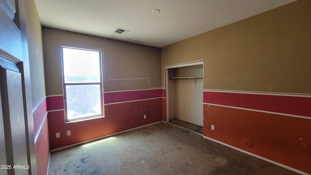 4432 W Pleasant Ln, Laveen, AZ 85339 - unfurnished bedroom with multiple windows, carpet flooring, a closet, and baseboards