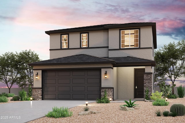 view of front of house with stucco siding, stone siding, a garage, and concrete driveway