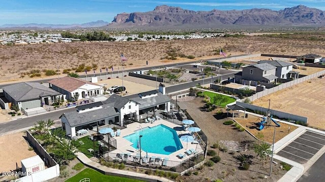 birds eye view of property featuring a mountain view and a desert view