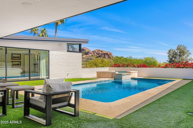 4218 E Palo Verde Dr, Phoenix, AZ 85018 - view of pool featuring a yard and a pool with connected hot tub