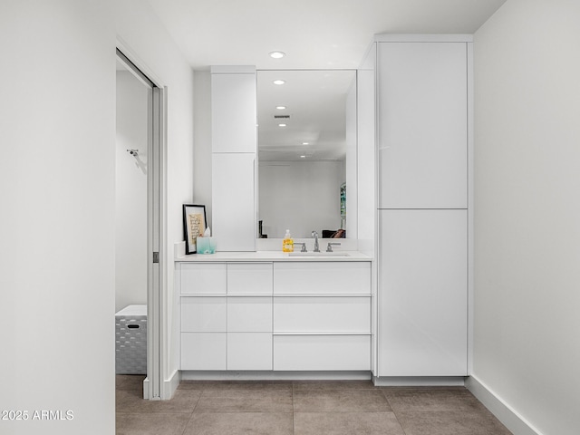 4218 E Palo Verde Dr, Phoenix, AZ 85018 - bathroom with vanity, baseboards, visible vents, and recessed lighting