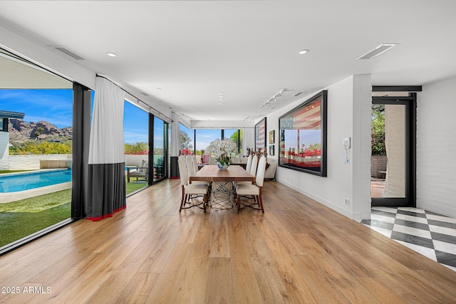 4218 E Palo Verde Dr, Phoenix, AZ 85018 - dining room with expansive windows, light wood-type flooring, visible vents, and recessed lighting