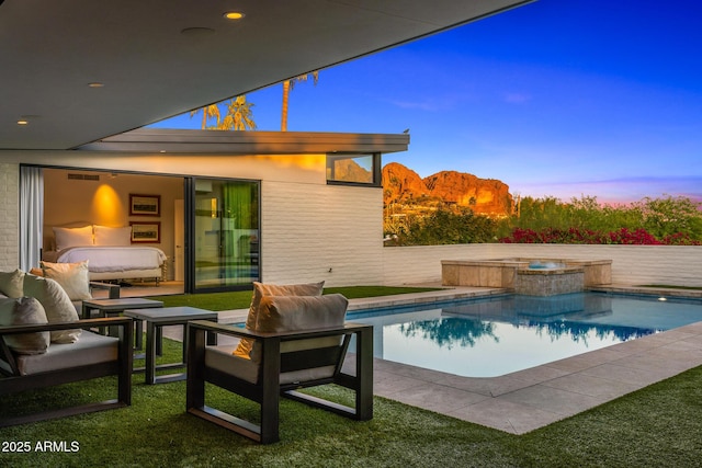 4218 E Palo Verde Dr, Phoenix, AZ 85018 - back of house at dusk with an outdoor pool