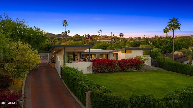 4218 E Palo Verde Dr, Phoenix, AZ 85018 - view of front facade featuring driveway and a lawn