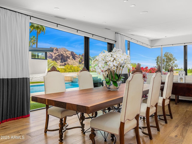 4218 E Palo Verde Dr, Phoenix, AZ 85018 - dining space featuring a mountain view, light wood-style floors, visible vents, and recessed lighting