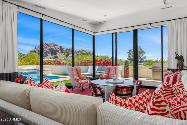 4218 E Palo Verde Dr, Phoenix, AZ 85018 - sunroom featuring a healthy amount of sunlight, a mountain view, and visible vents