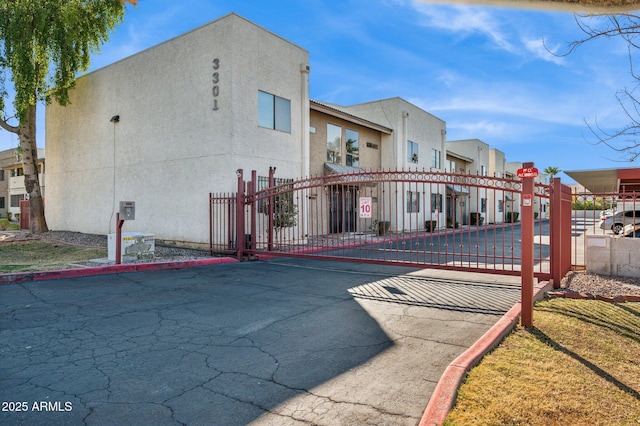 view of gate featuring fence