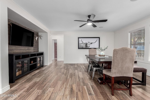 dining space featuring ceiling fan, crown molding, and wood-type flooring