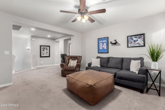 living room featuring ceiling fan and light colored carpet