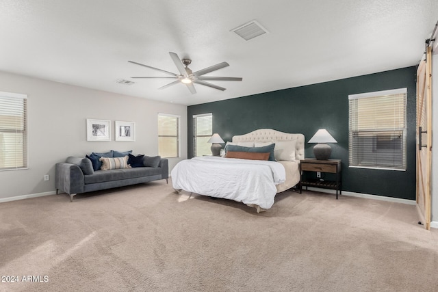 bedroom featuring ceiling fan and light carpet