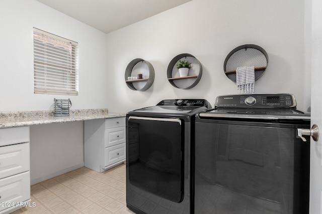 washroom with washer and dryer