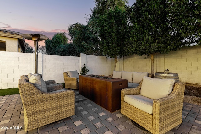 view of patio terrace at dusk