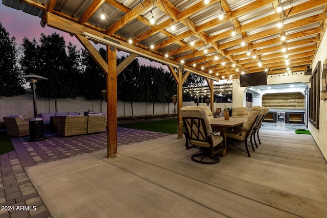 patio terrace at dusk featuring an outdoor living space