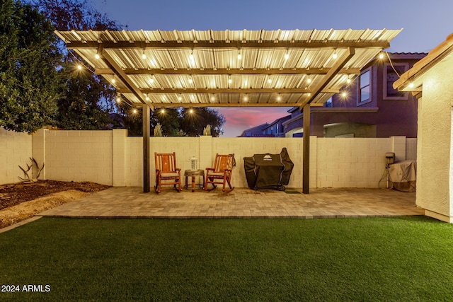 yard at dusk with a pergola and a patio