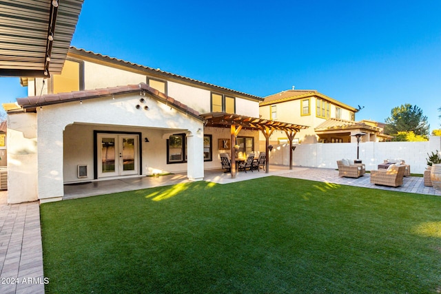 back of property with a yard, french doors, a pergola, an outdoor hangout area, and a patio area