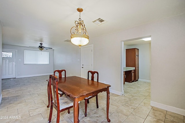 6120 W Keim Dr, Glendale, AZ 85301 - dining space with baseboards, a ceiling fan, and visible vents