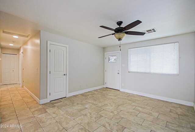 6120 W Keim Dr, Glendale, AZ 85301 - foyer entrance featuring visible vents, baseboards, a ceiling fan, and light tile patterned floors