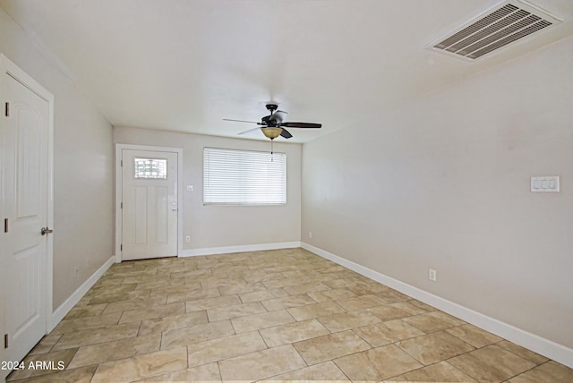 6120 W Keim Dr, Glendale, AZ 85301 - foyer entrance featuring ceiling fan, baseboards, visible vents, and light tile patterned floors