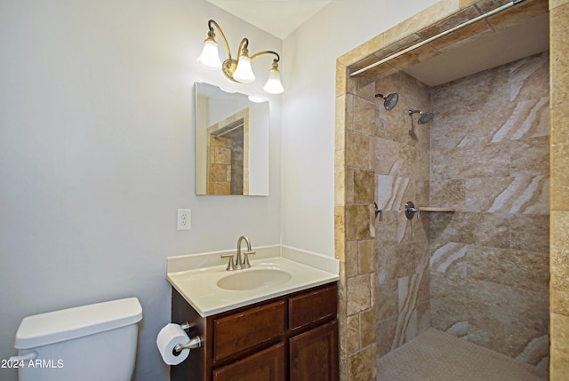 6120 W Keim Dr, Glendale, AZ 85301 - bathroom with toilet, vanity, and a tile shower