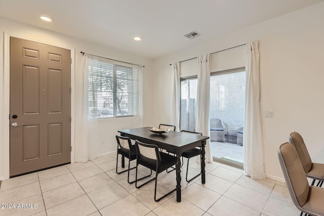 dining area featuring light tile patterned floors