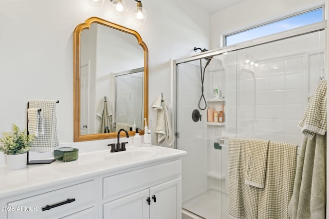 bathroom with vanity and an enclosed shower