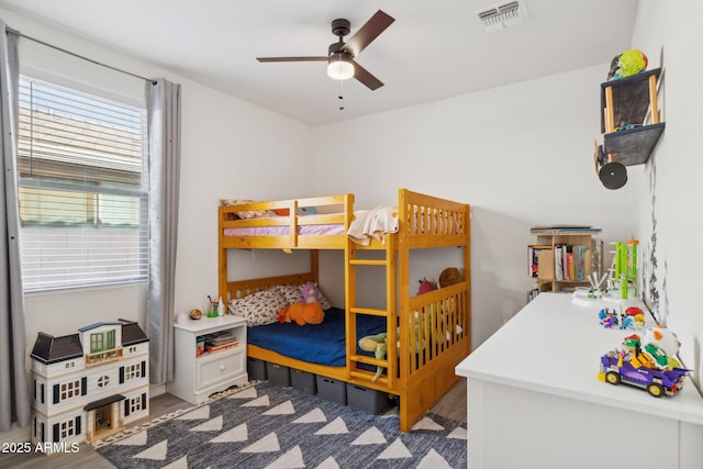 bedroom featuring hardwood / wood-style floors and ceiling fan