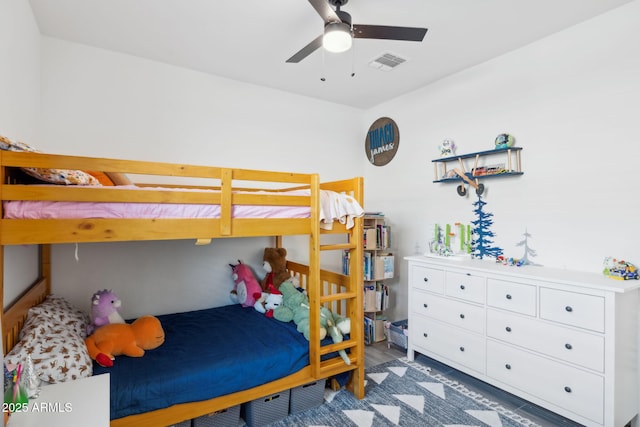 bedroom featuring ceiling fan and dark wood-type flooring