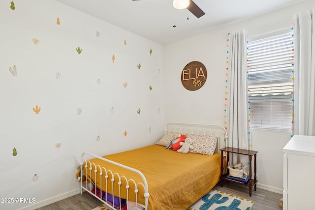 bedroom featuring hardwood / wood-style floors and ceiling fan