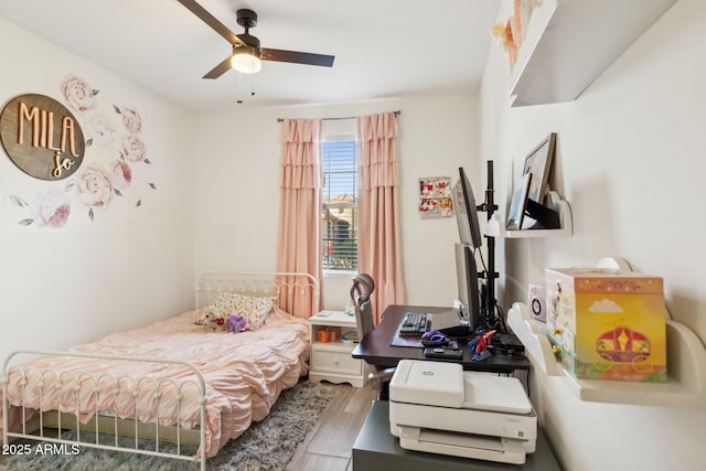 bedroom with ceiling fan and wood-type flooring