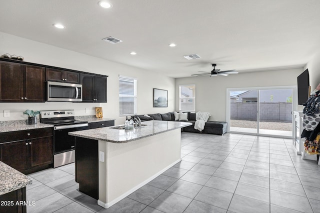 kitchen featuring visible vents, plenty of natural light, stainless steel appliances, and a sink