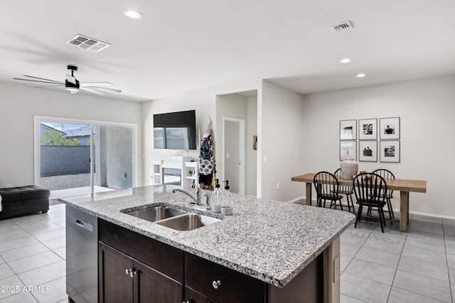 kitchen with a sink, visible vents, dishwasher, and open floor plan