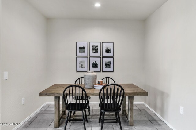 tiled dining area with baseboards