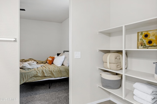 carpeted bedroom with baseboards