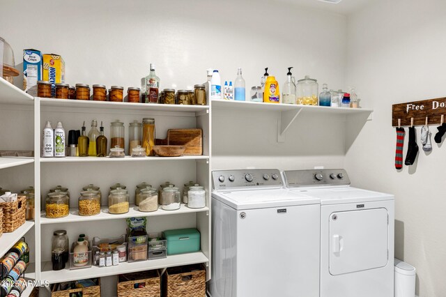 washroom with washer and dryer and laundry area