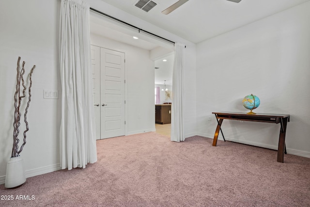 corridor featuring baseboards, visible vents, and carpet flooring