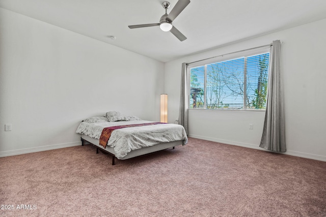 bedroom featuring carpet floors, a ceiling fan, and baseboards