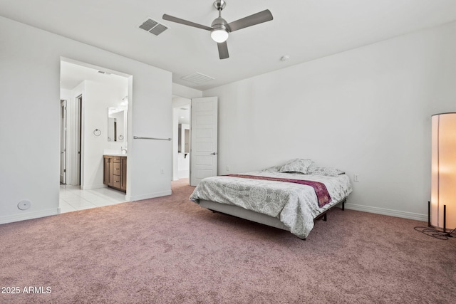 bedroom with light carpet, visible vents, and baseboards