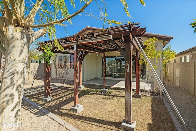 view of play area with a patio area, a fenced backyard, and a pergola