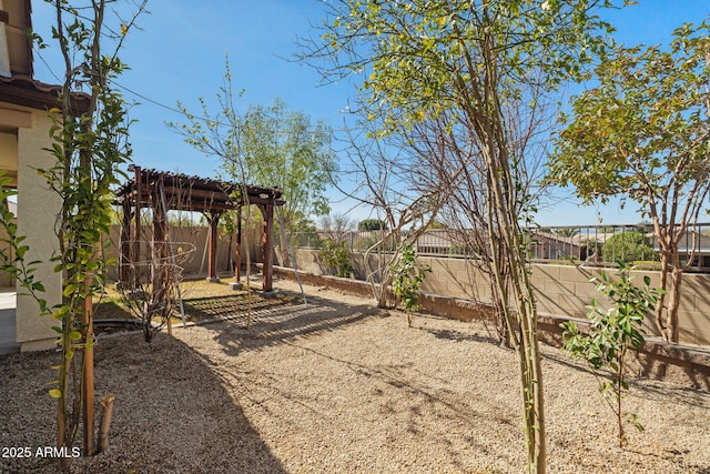 view of yard with a fenced backyard and a pergola