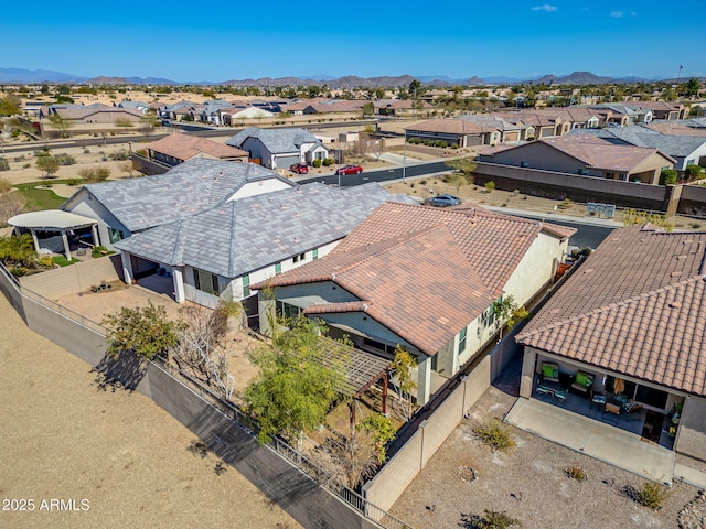 drone / aerial view featuring a residential view and a mountain view