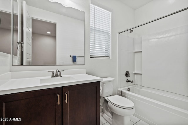 bathroom featuring tile patterned flooring, shower / bath combination, vanity, and toilet