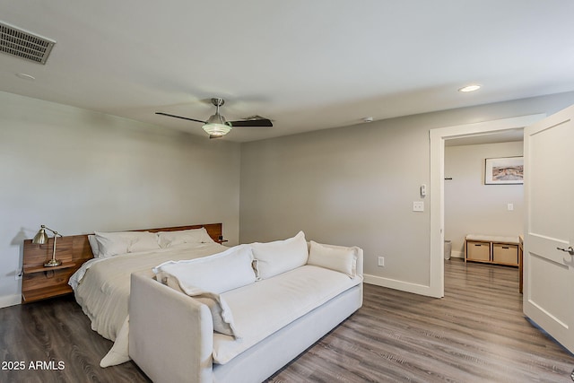 bedroom featuring recessed lighting, baseboards, wood finished floors, and visible vents