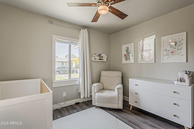 bedroom with dark wood-type flooring, baseboards, and ceiling fan