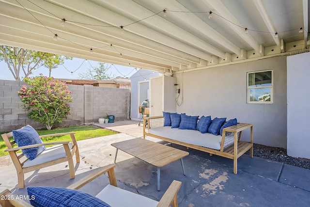 view of patio / terrace featuring fence and outdoor lounge area