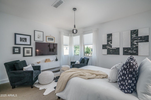 carpeted bedroom with visible vents