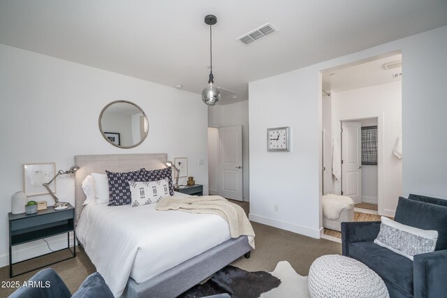 bedroom featuring carpet floors, baseboards, and visible vents