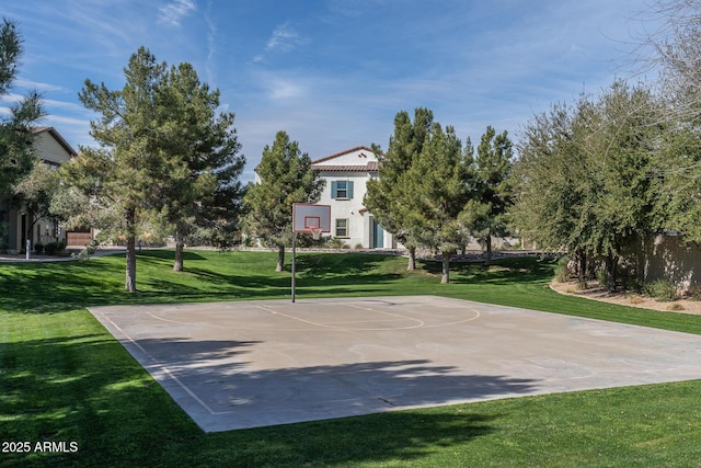 view of sport court featuring a lawn and community basketball court